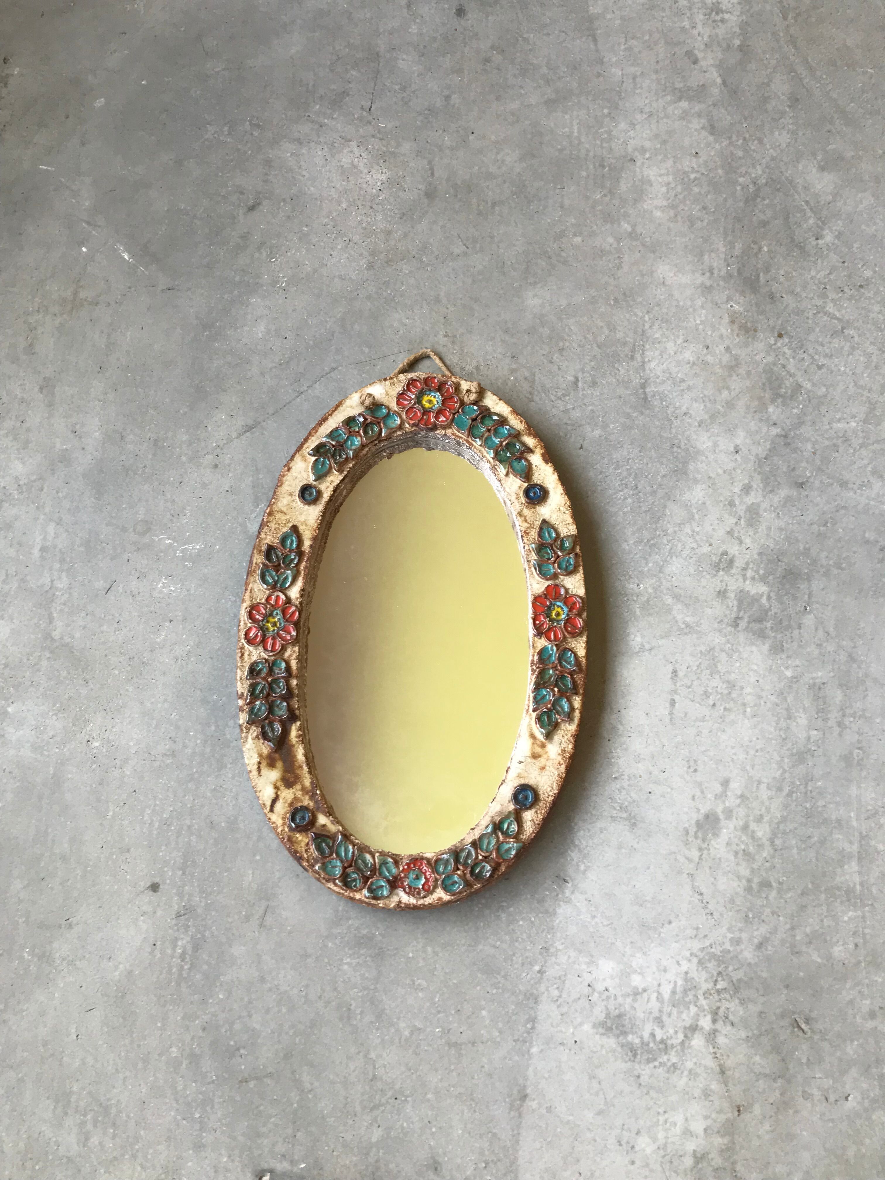 Ceramic mirror decorated with flowers, circa 1960 25x40cm