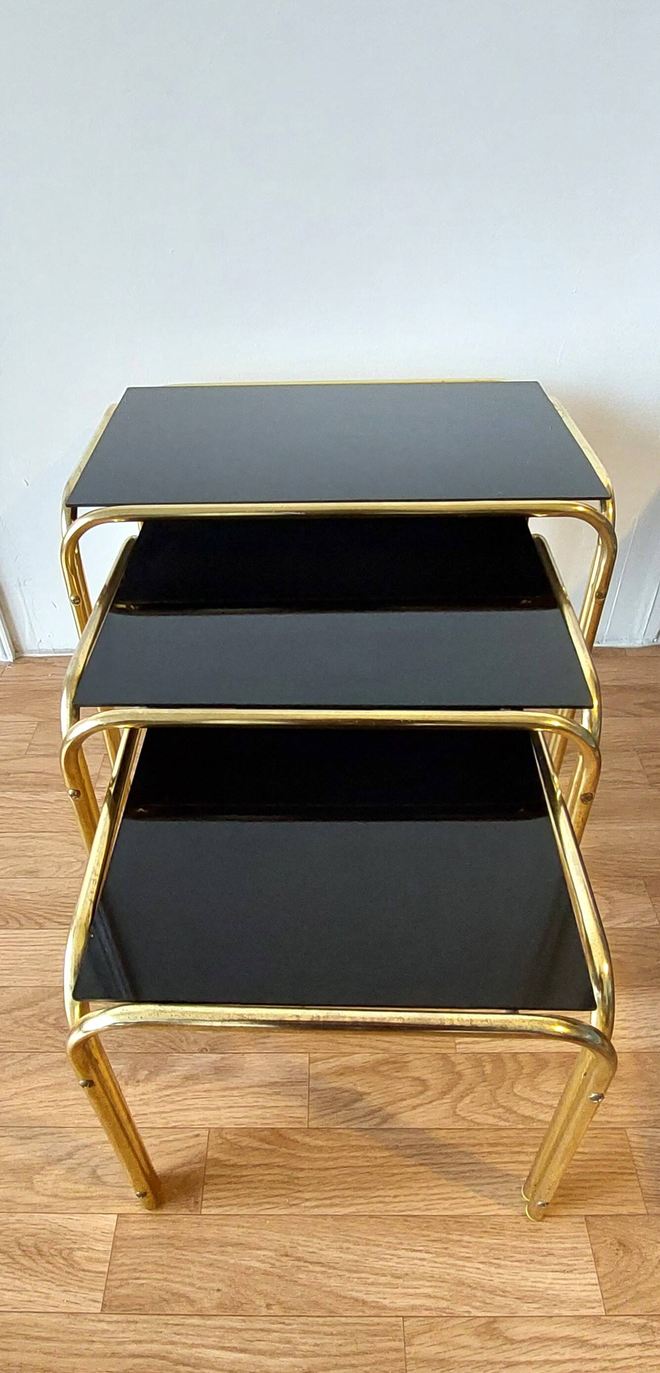 Vintage 1970 gold metal nesting tables.