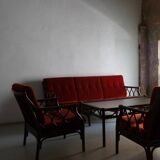 Dark rattan 3-seater sofa with red velour cushions | 1980s