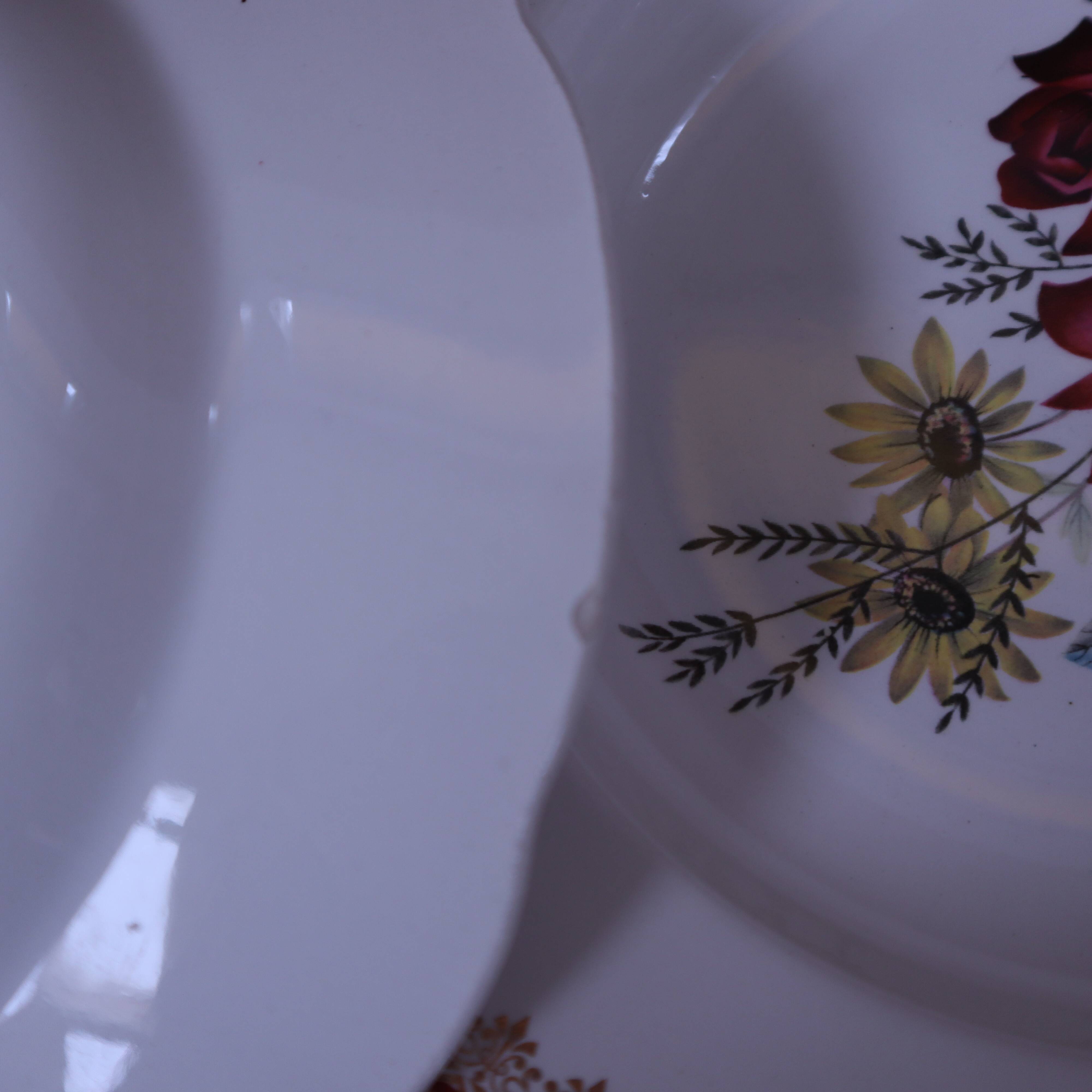 8 deep plates in half porcelain signed FB Floral decoration