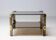 Hollywood Regency coffee table in brass and smoked glass, chic two-tier coffee table.