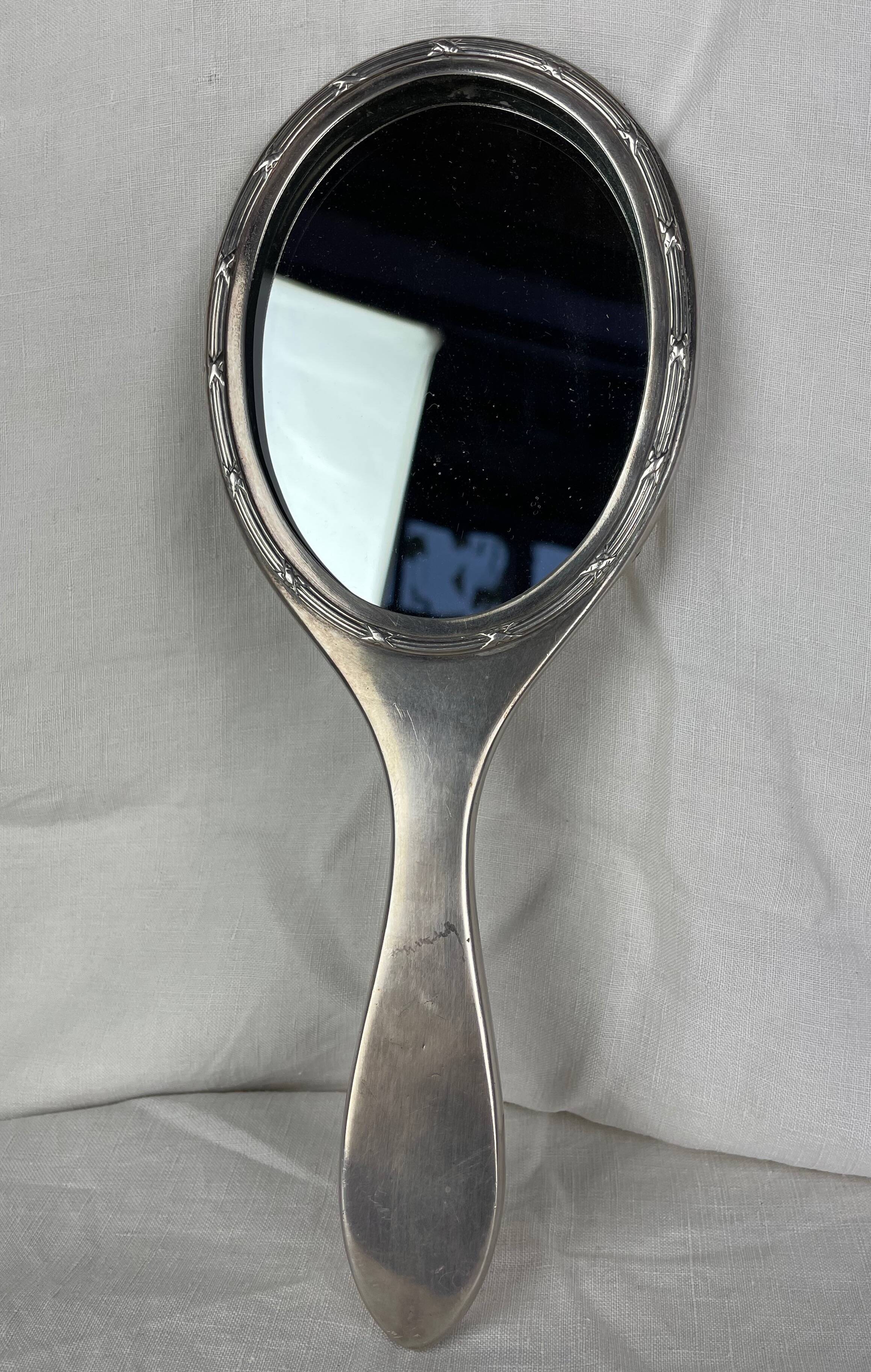 Silver metal hand mirror