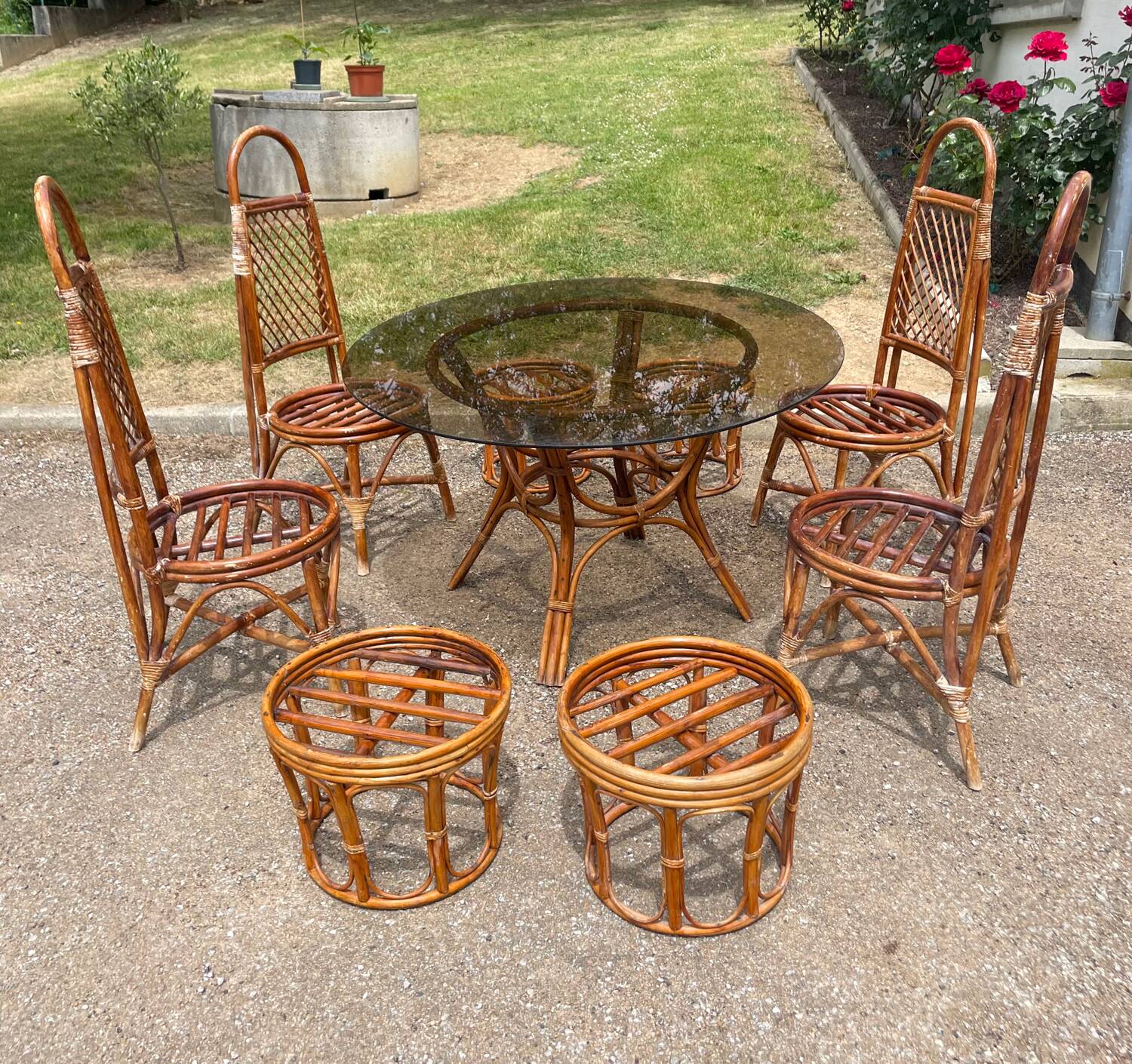 Vintage rattan dining set with glass table, 4 chairs and 4 stools.