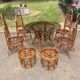 Vintage rattan dining set with glass table, 4 chairs and 4 stools.