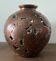 Vase boule en verre à motifs arabesques métalliques