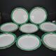 Paris porcelain set of 12 flat plates with green border and gold monogram JC.