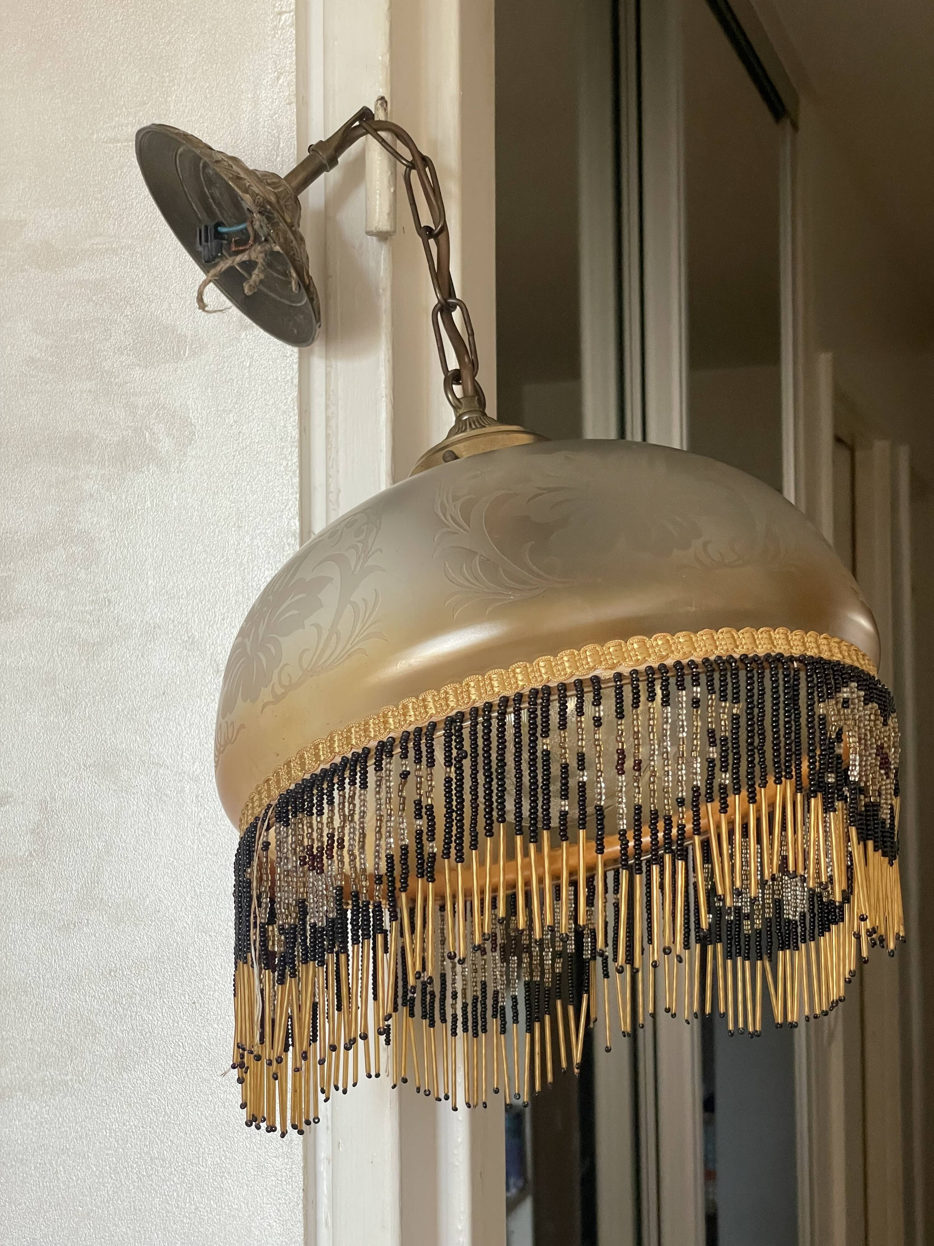 Glass lampshade and pearl tassels