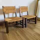 Pair of low wooden and straw armchairs