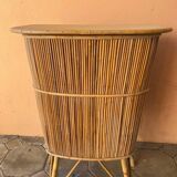 Vintage rattan bar from the 60s with rounded shapes and a shelf for glasses