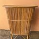 Vintage rattan bar from the 60s with rounded shapes and a shelf for glasses