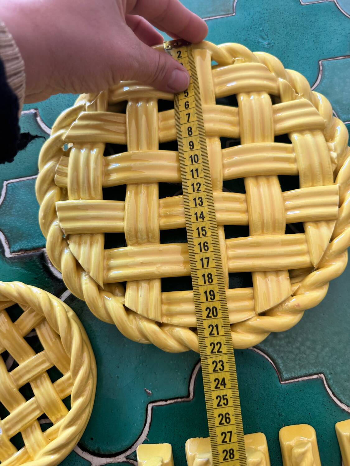 2 yellow ceramic trivets and knife rests