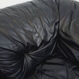 Vintage corner sofa composed of 3 modules in black leather with integrated bed.