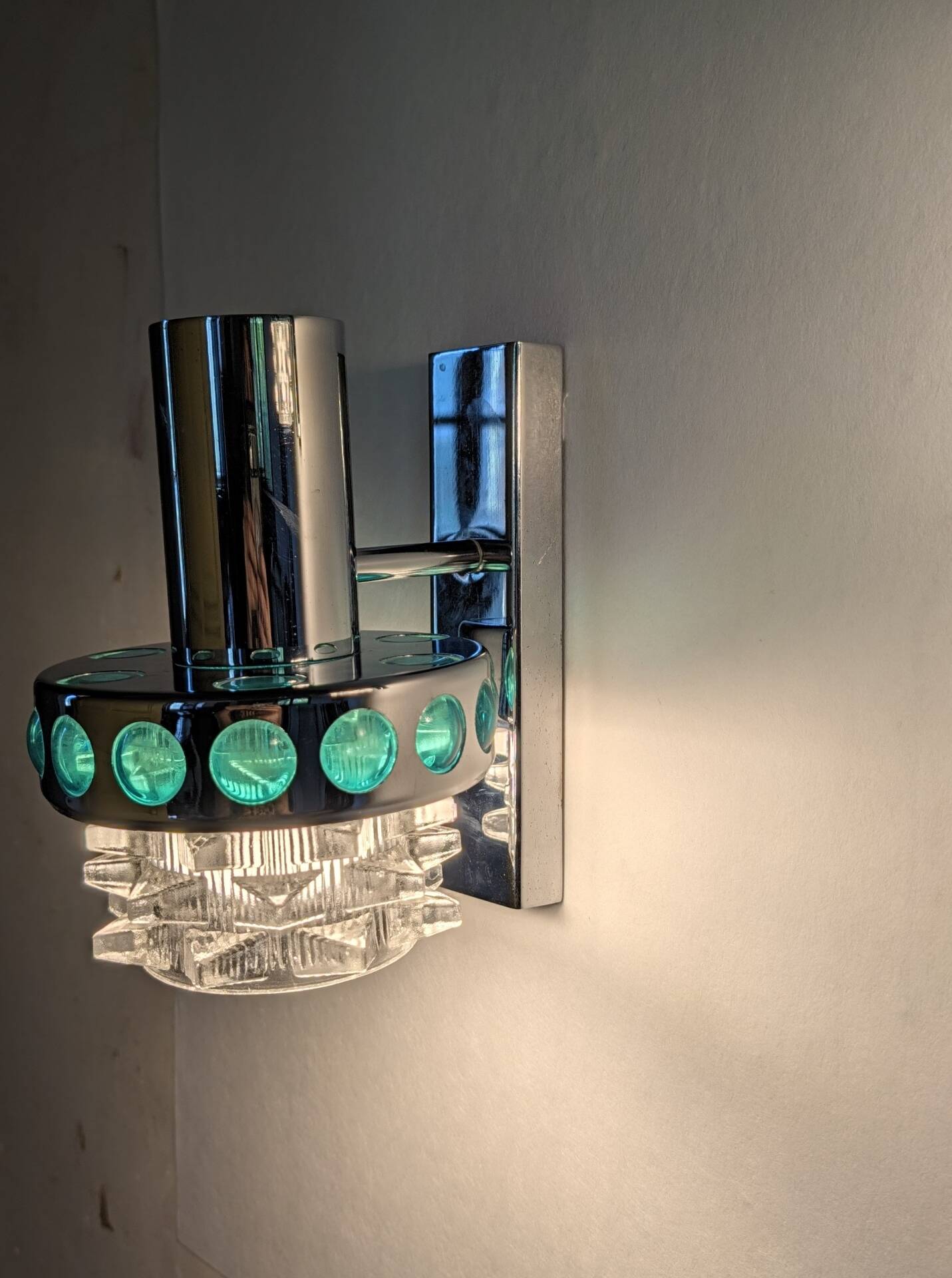 Pair of Space Age wall lights in chrome and green glass, 1970s.