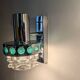 Pair of Space Age wall lights in chrome and green glass, 1970s.