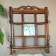 Art Deco wall-mounted coat rack in oak, early 20th century. Beveled central mirror