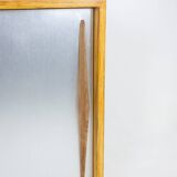 Low ash sideboard with sliding doors. 1960s.