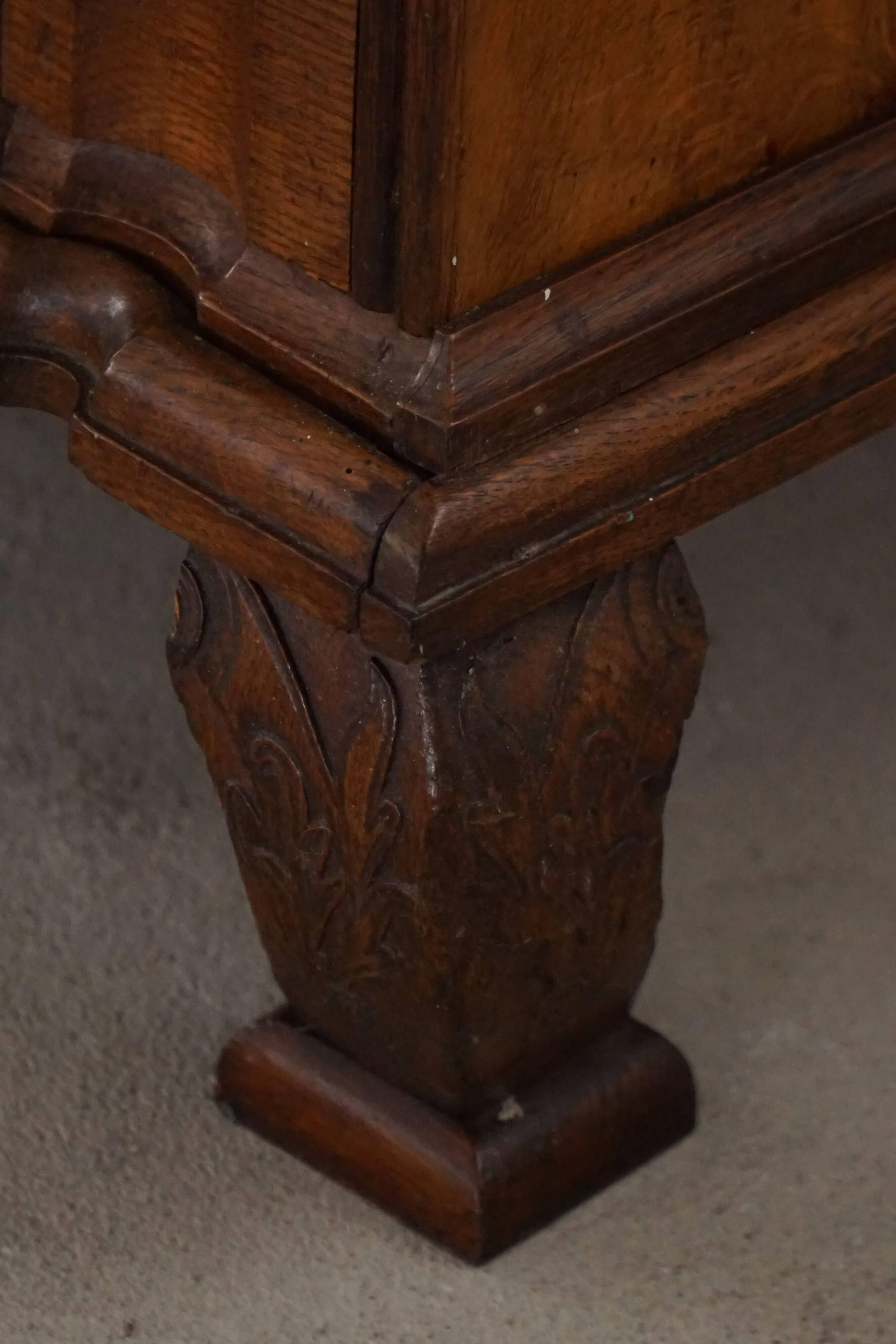 Antique baroque oak commode from the late 18th century with cabriole legs.