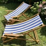 Pair of wooden deck chairs with armrests in blue bayadere fabric