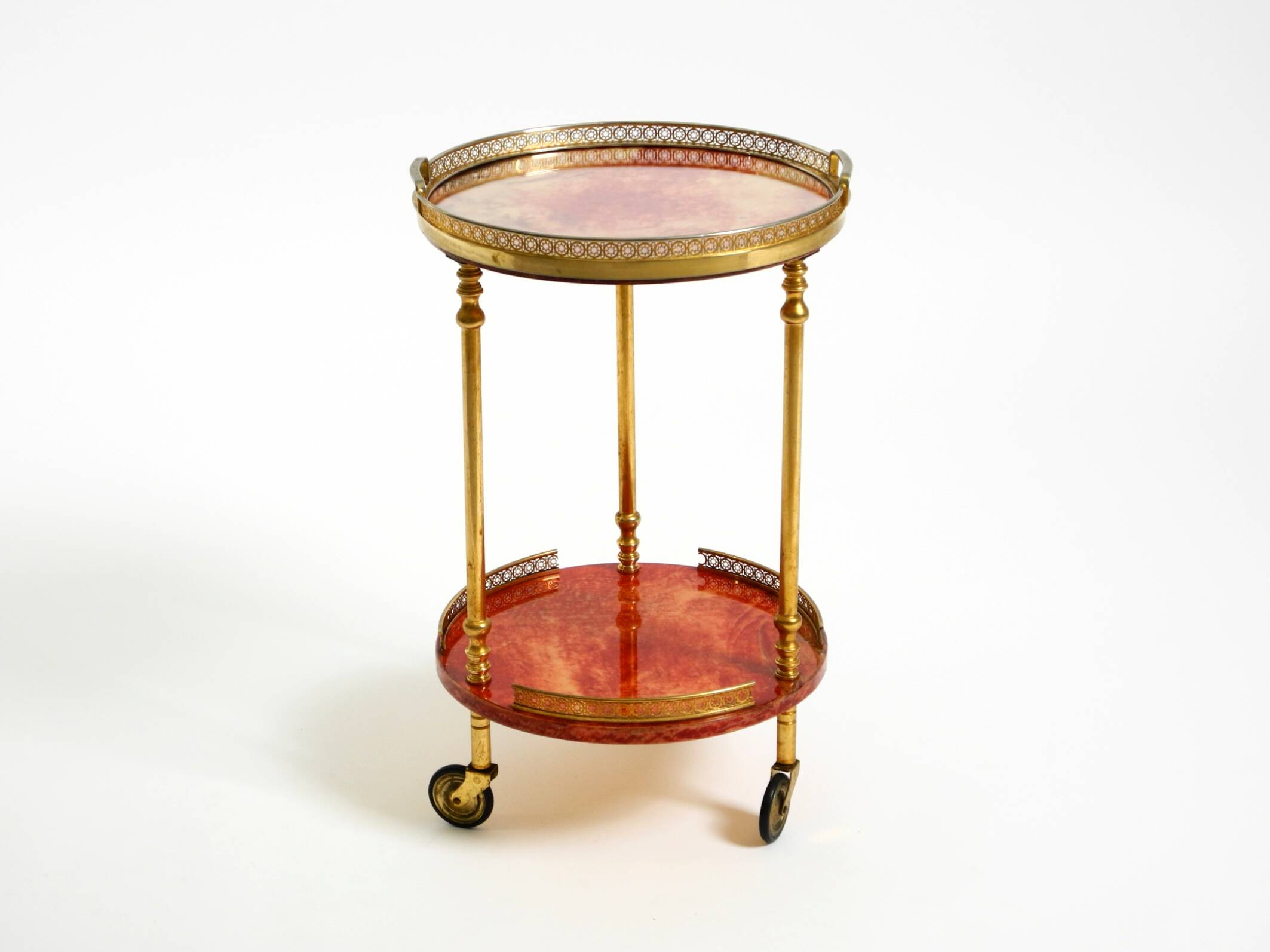 Round, small 1960s Aldo Tura serving or bar trolley in red goatskin leather