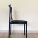 4 postmodern design chairs in black metal and leather, 1980's