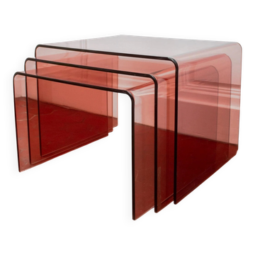 Vintage trio of nesting tables in smoked plexiglass by Michel Dumas, year