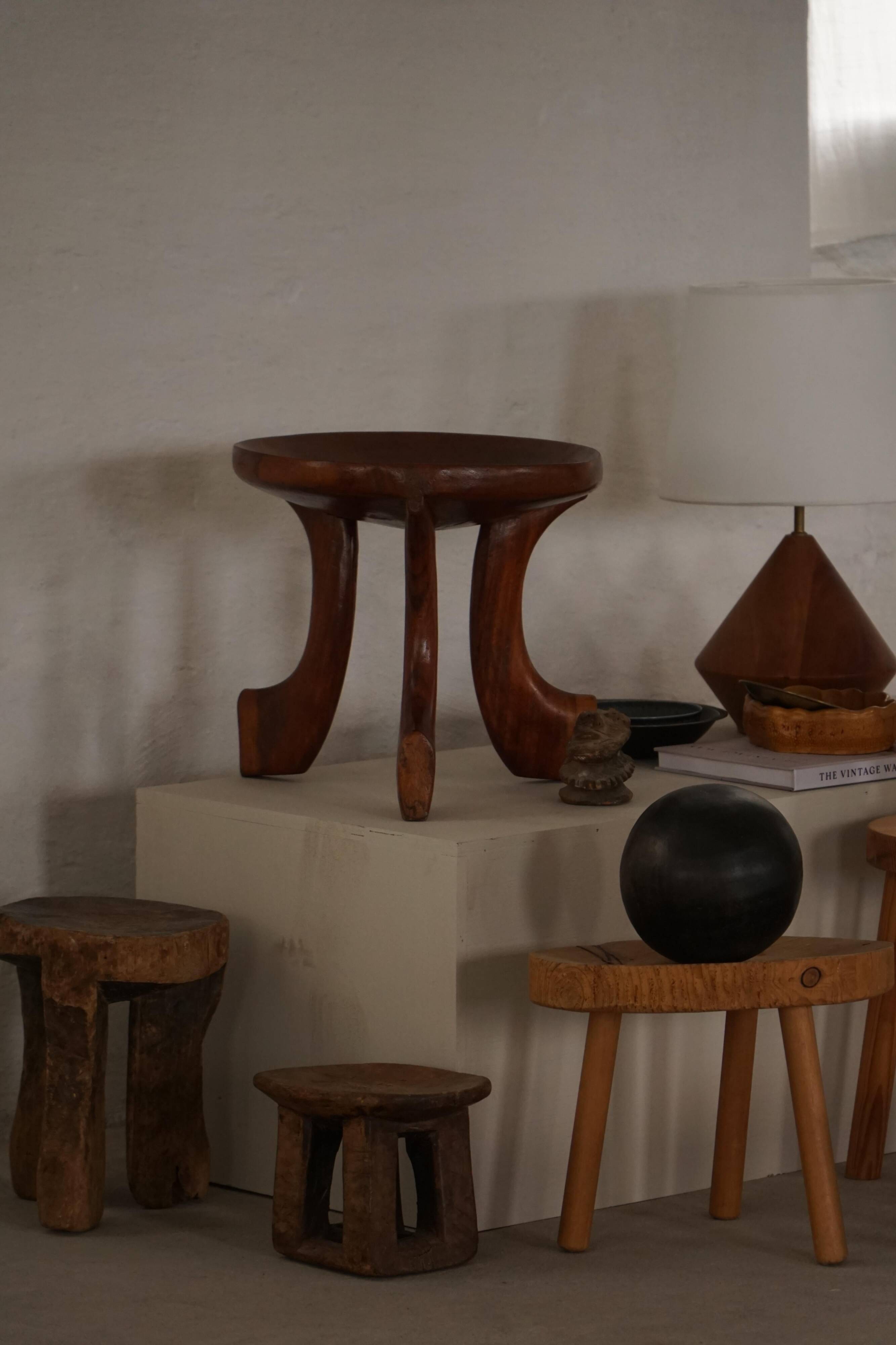 Oromo stool from mid-20th century Africa, hand-carved wood, tribal style.