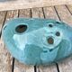 Roller spike flowers, blue-green ceramics