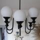 Metal chandelier and glass globes