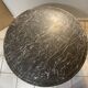 Table  ronde en marbre gris veiné