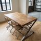 Industrial wooden dining table: spacious top and 4 matching chairs.