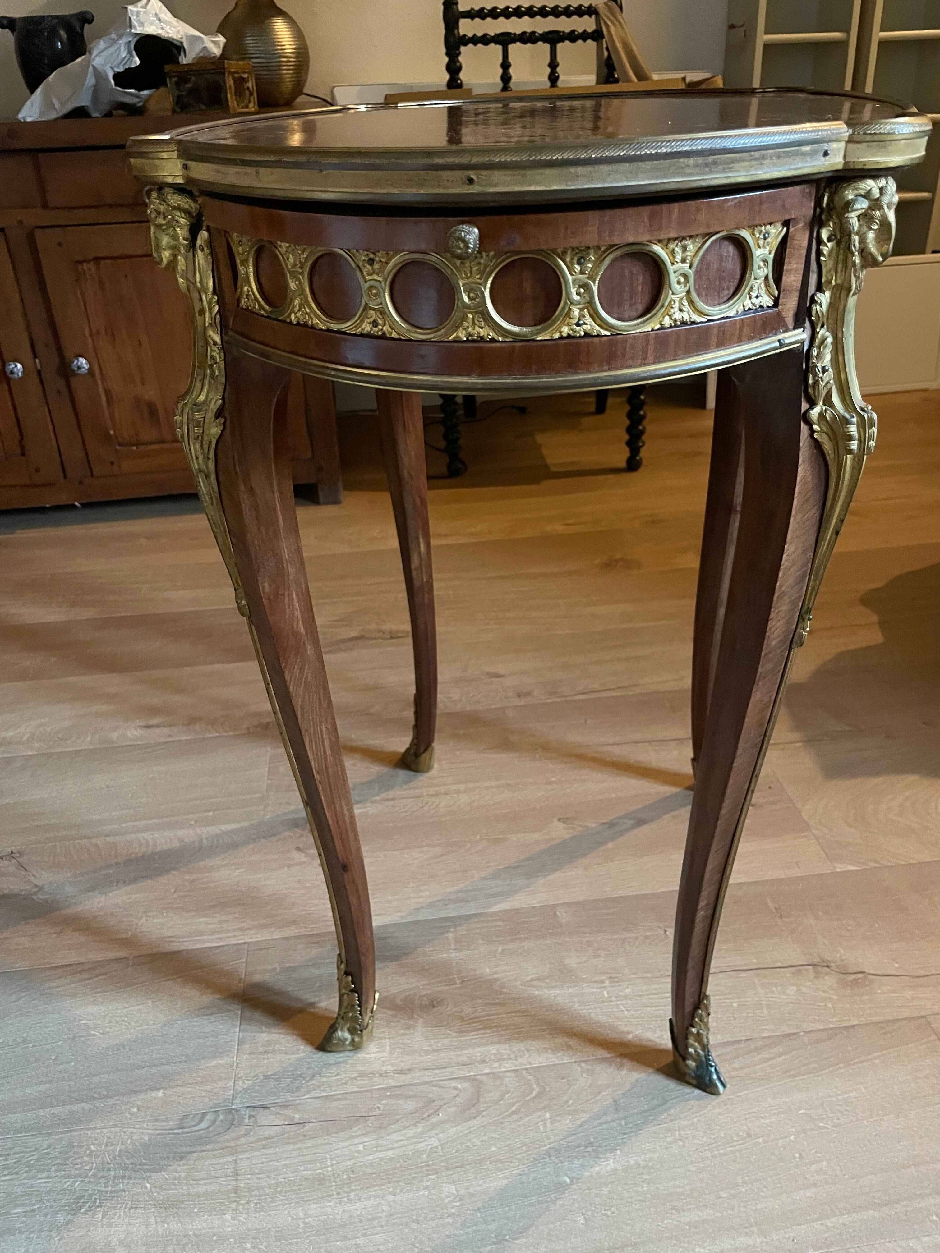 Living room table in Louis XV-Louis XVI transitional style with marquetry and bronze.