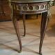 Living room table in Louis XV-Louis XVI transitional style with marquetry and bronze.