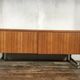 Sideboard in teak feet chrome sliding doors by Voko in 1960