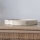 Small round tray in travertine