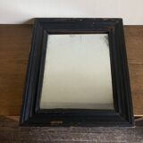 19th century blackened mirror with pitted glass 34cm x 40cm
