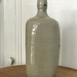Old light grey ceramic bottle