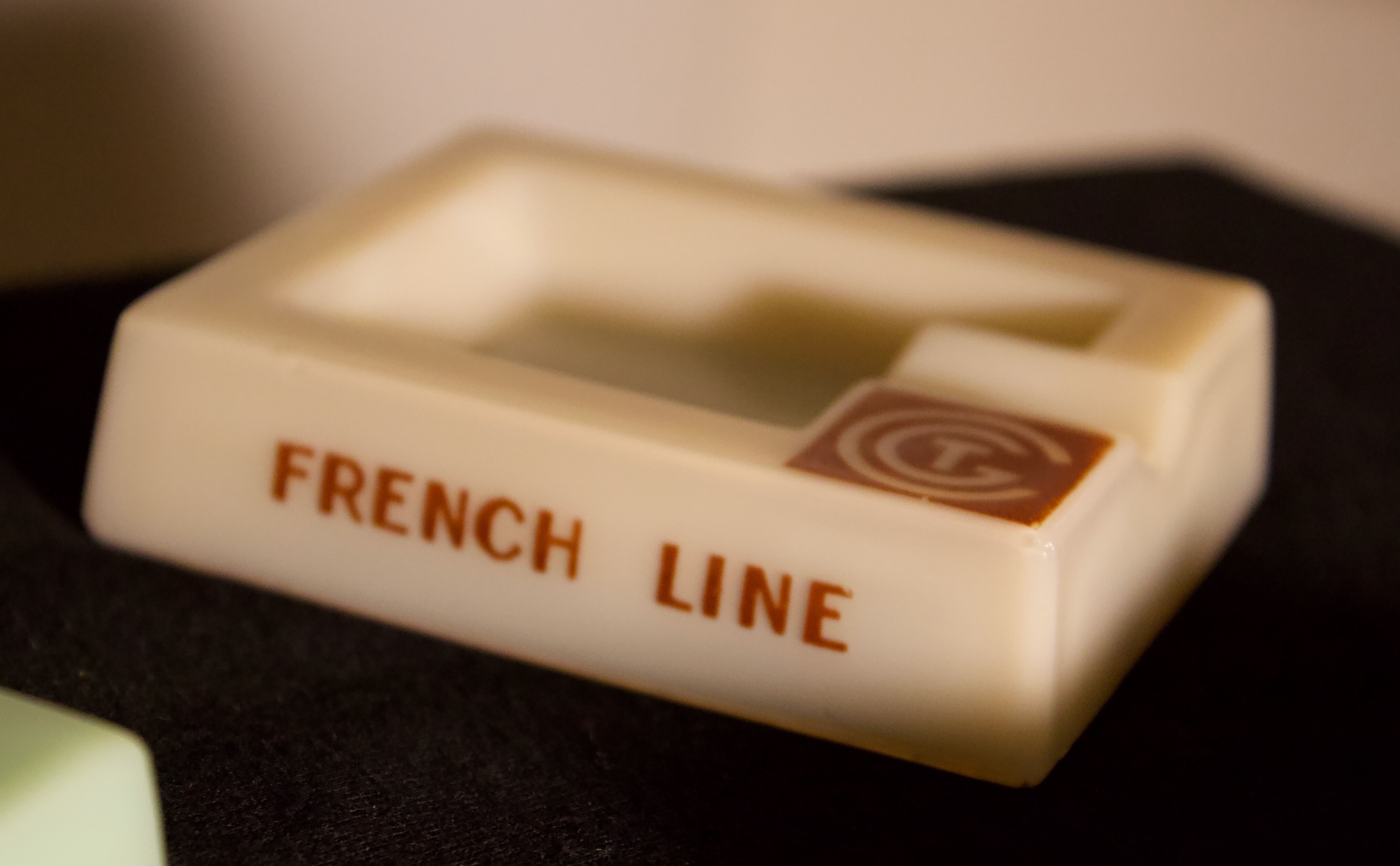 Three opalex ashtrays at the Logo of the Trans-Atlantic General Company - French Line - Model created by Jean Luce for the cruises of the liner Normandy and France