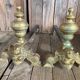 Pair of andirons and grates in cast iron and bronze with gilded grotesques, 17th century