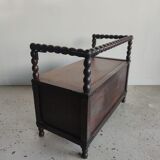 Natural wood chest forming a bench, ringed shoulders