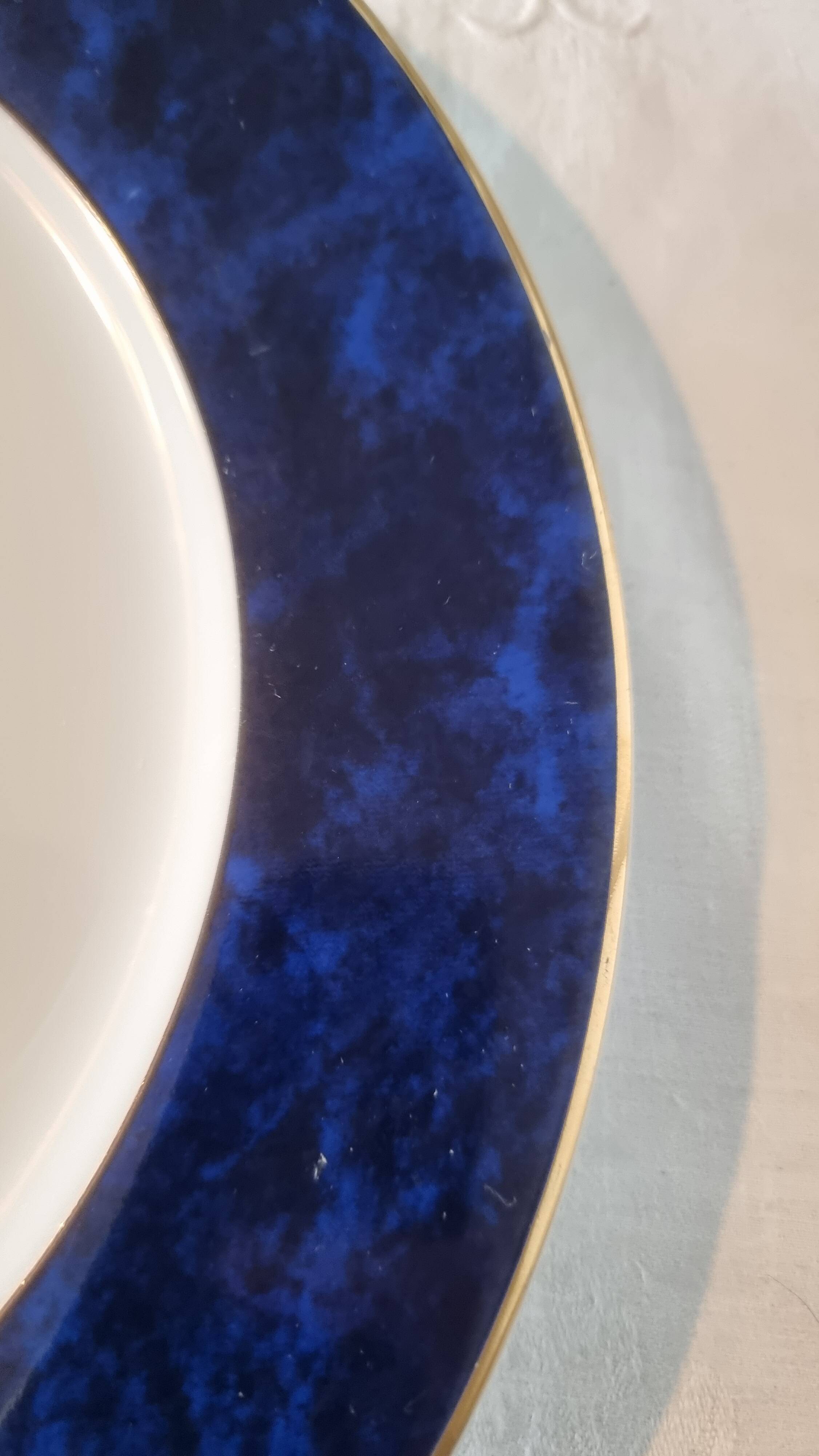 18-piece porcelain dinnerware set from Limoges by Philippe Deshoulières.