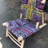 Wooden armchair braiding multicolored fabrics