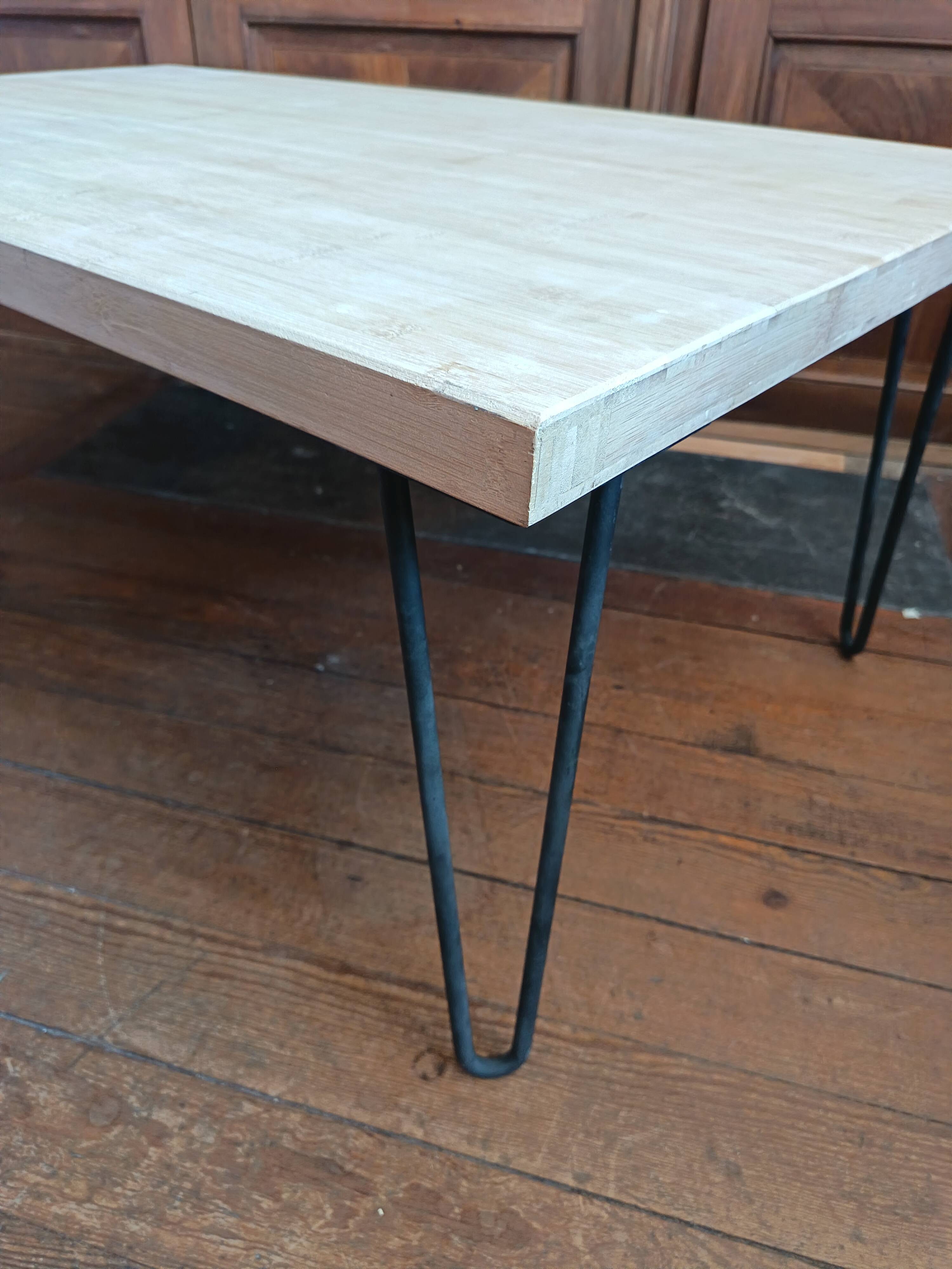 Coffee table in solid bamboo with steel legs.