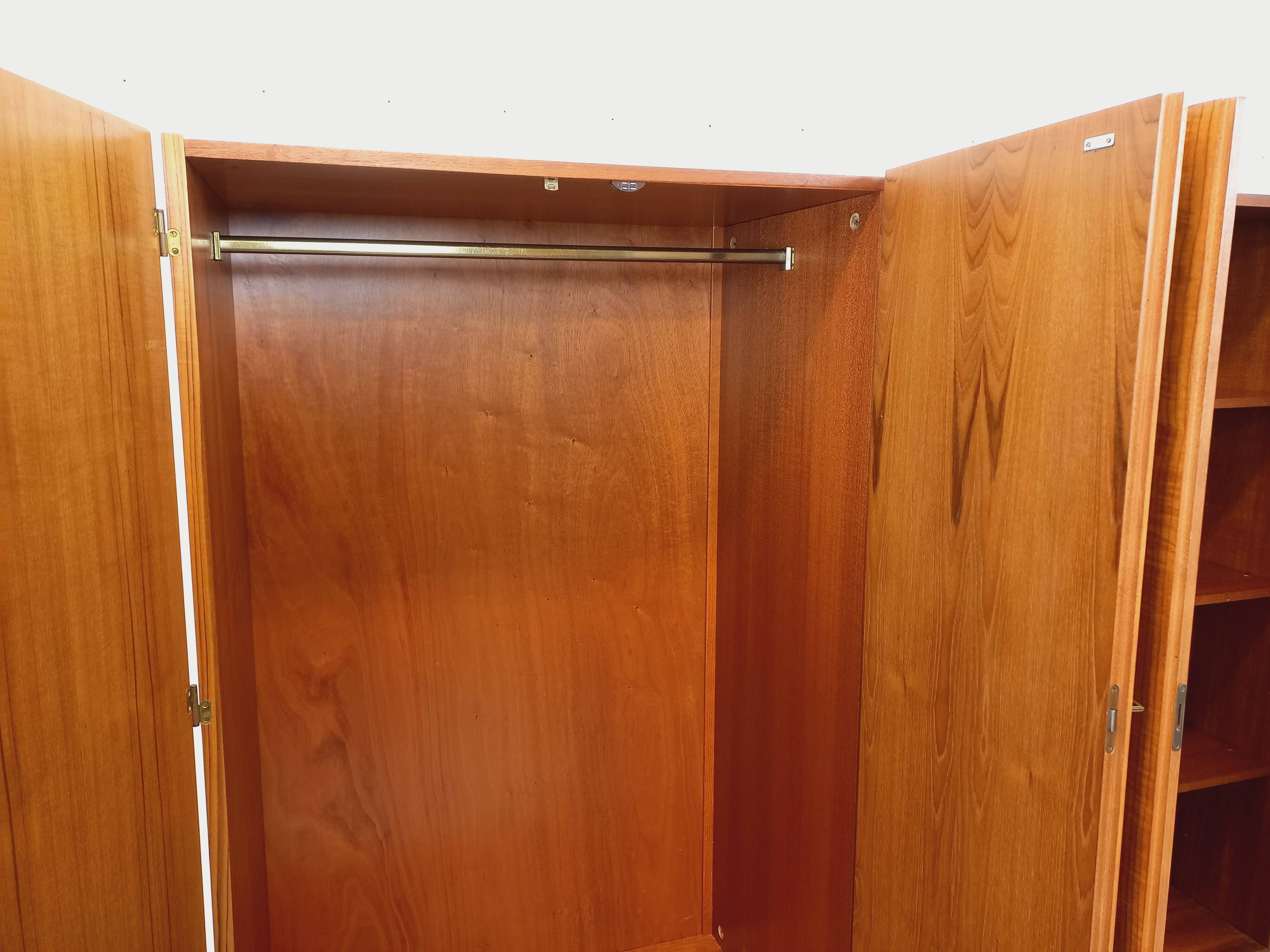 Vintage modernist wardrobe in teak and metal from the 1960s.