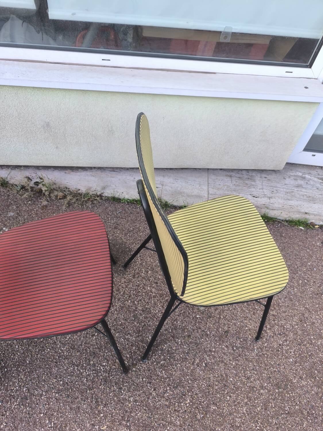 Set of 3 vintage yellow and red faux leather chairs.