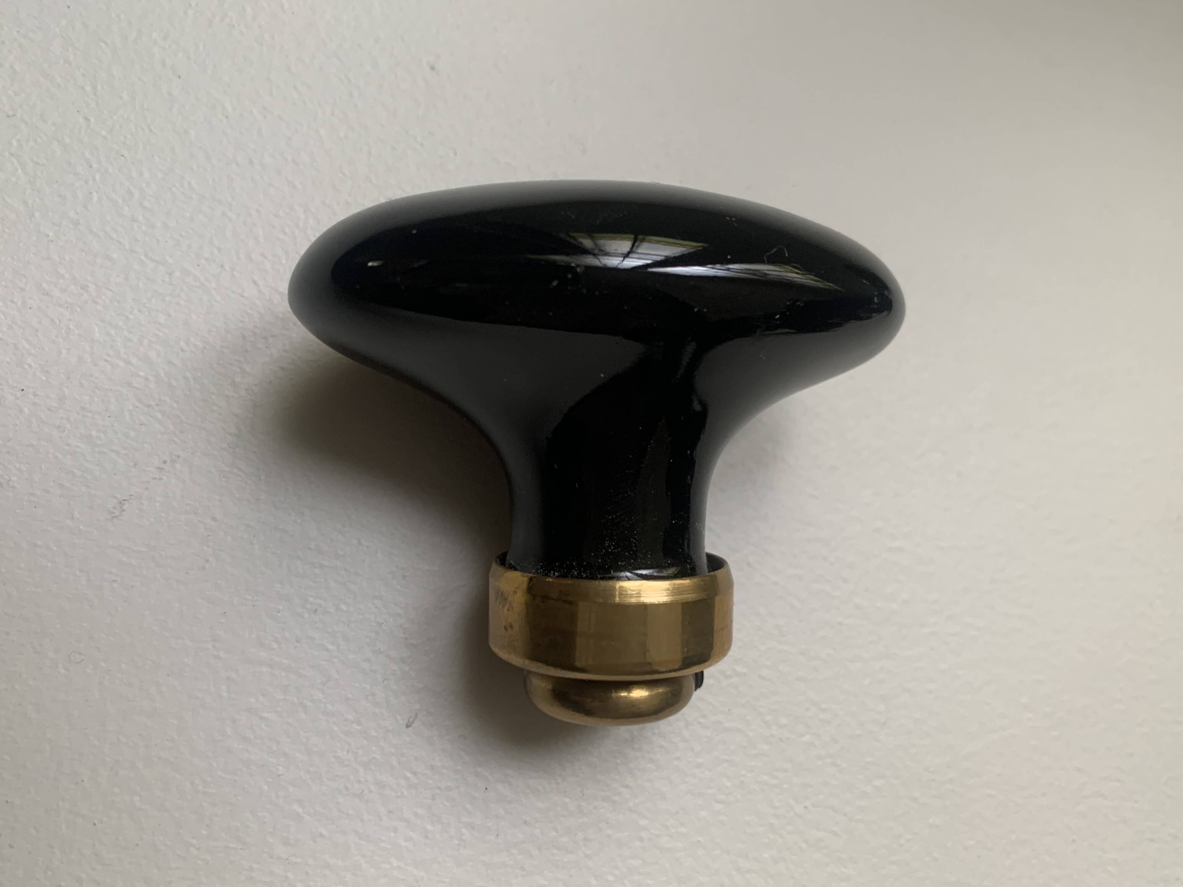 Black porcelain and brass handles