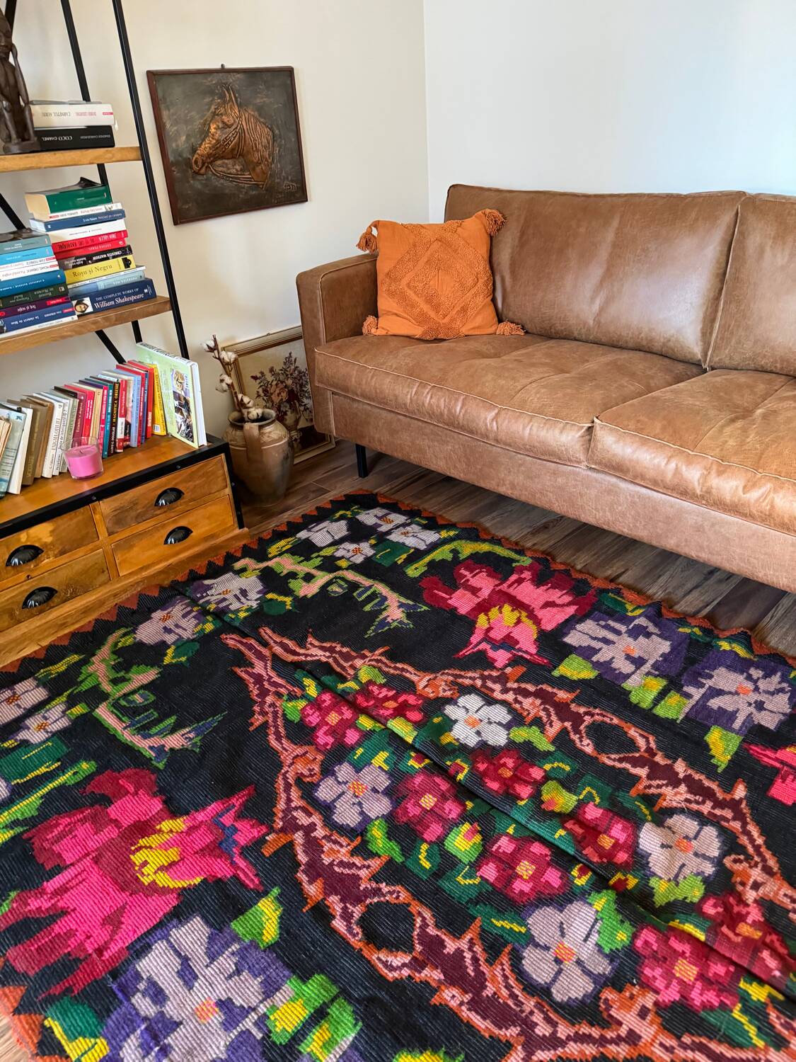 Bohemian floral design, handwoven wool rug, black background with colorful flowers