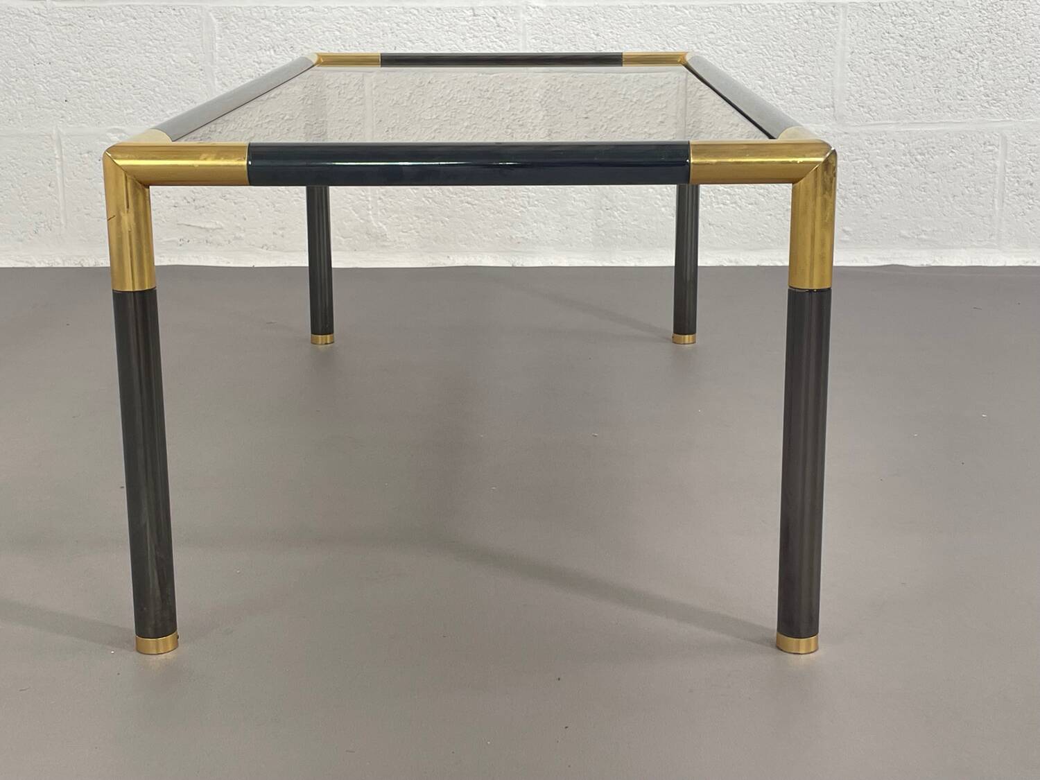 Gunmetal gold metal and smoked glass coffee table from the 70s