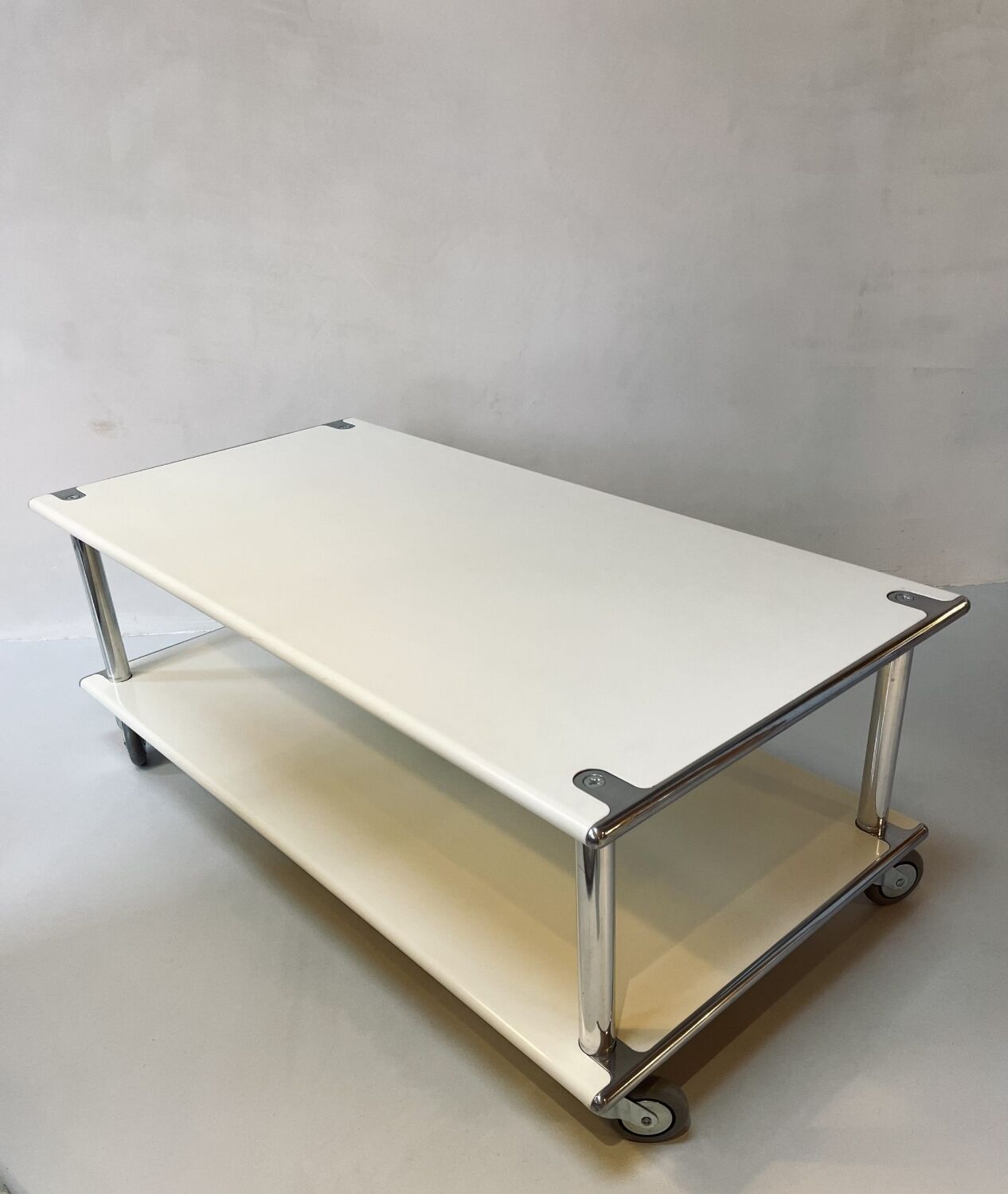 Vintage steel coffee table from the 1970s on wheels.