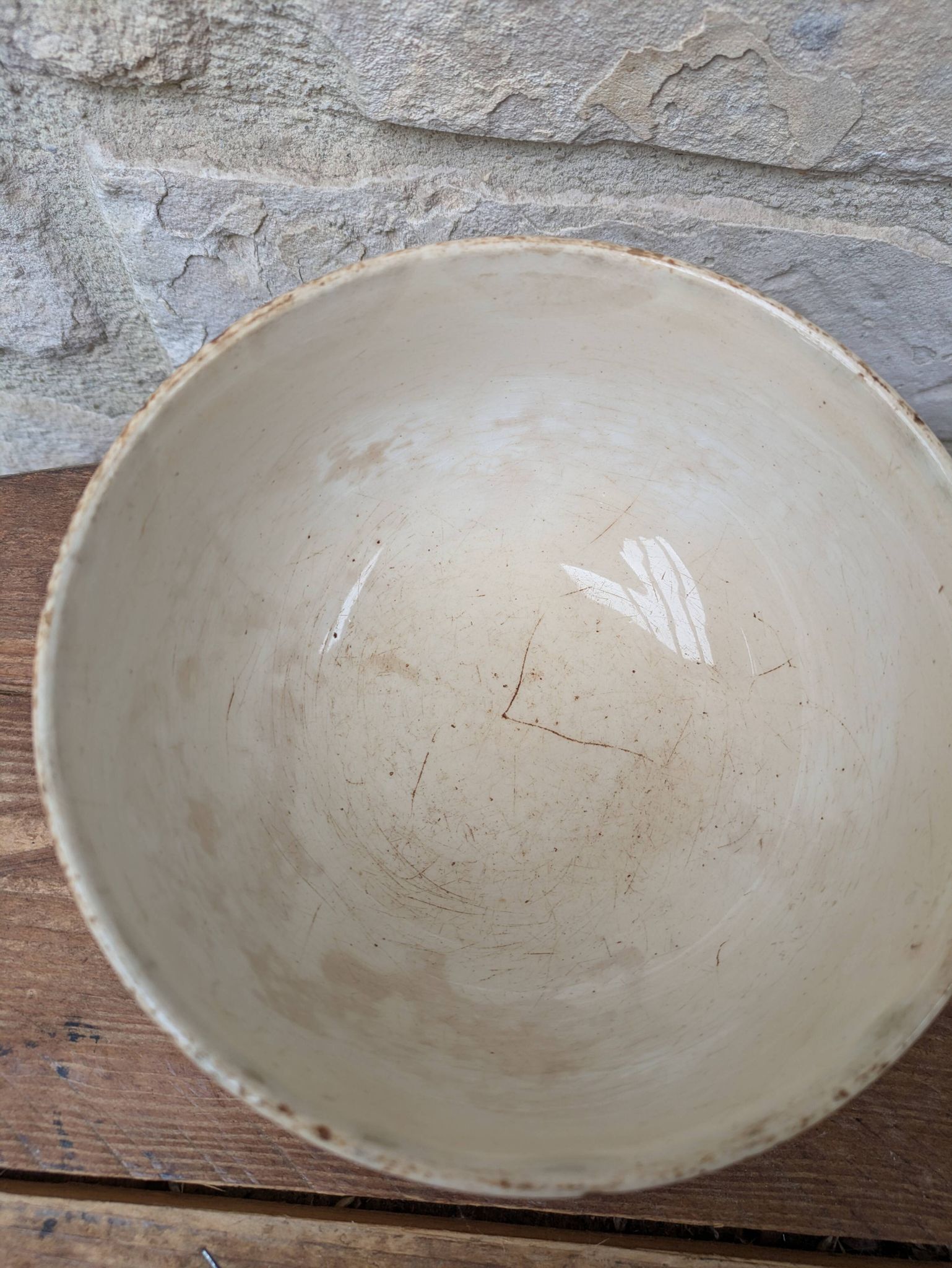 Old opaque porcelain bowl from Gien with a floral decoration.