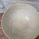 Old opaque porcelain bowl from Gien with a floral decoration.